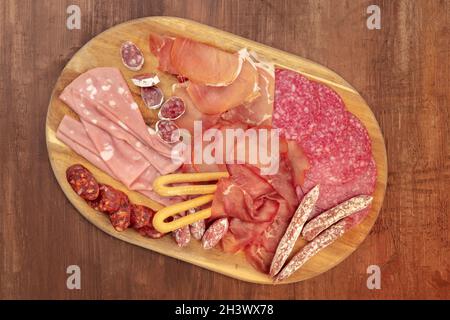 Charcuterie Tasting. An overhead photo of a tray with many different sausages Stock Photo