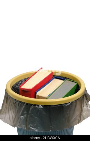 Trash can and the books thrown into it, on a white background, are isolated Stock Photo