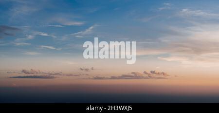 Pink and blue sunset sky with colorful clouds. Stock Photo