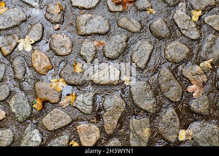 Abstract background of old cobblestone pavement close-up Stock Photo