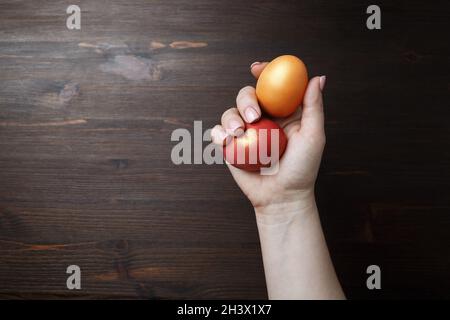 Easter eggs in female hand Stock Photo