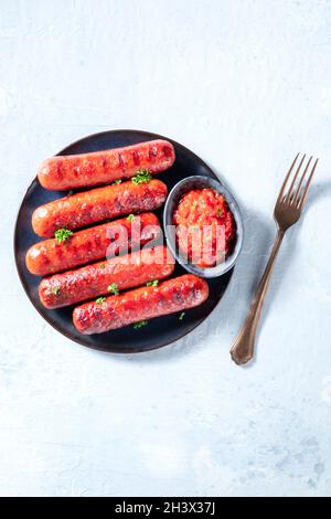 Grilled sausages, shot from above. Barbecue meal Stock Photo