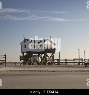 Pile dwellings in the mudflats at low tide, Sankt Peter-Ording,, Schleswig-Holstein, Germany, Europe Stock Photo