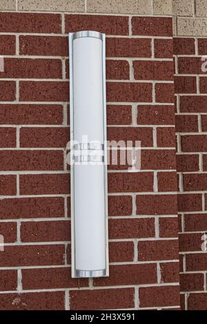 An LED light panel on a brick wall background texture Stock Photo