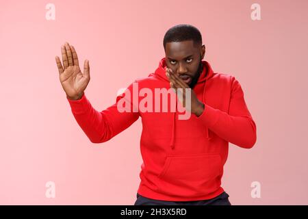 Guy knows asian fighting skills. Portrait serious-looking funny african-american young man perform martial arts standing kung-fu Stock Photo