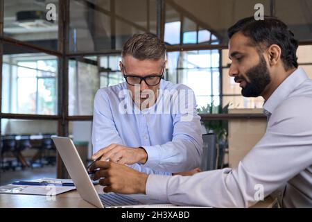 Diverse businesspeople executive team negotiating at boardroom meeting. Stock Photo