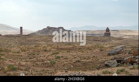 A ruined mediaeval Armenian city Ani, Kars Province, Turkey. Ebu’l Manuçehr Mosque (right), Citadel (distant centre), Apostles church (centre); Polato Stock Photo