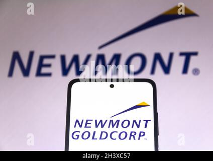 Brazil. 30th Oct, 2021. In this photo illustration the Newmont Mining Corporation logo seen displayed on a smartphone and on the background. Credit: SOPA Images Limited/Alamy Live News Stock Photo