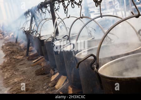 Preparation of food in boilers on an open fire in a traditional style Stock Photo