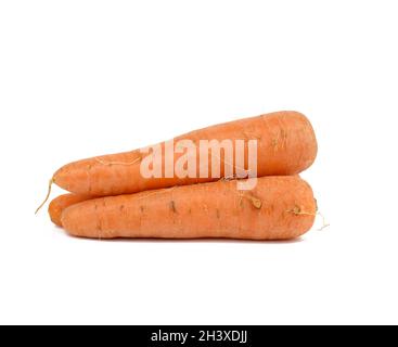 Whole orange raw carrot isolated on white background. Delicious and healthy vegetable Stock Photo