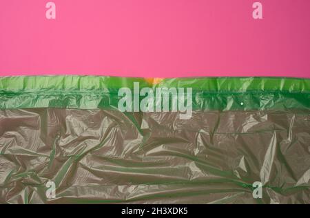 Crumpled green polyethylene texture, close up Stock Photo