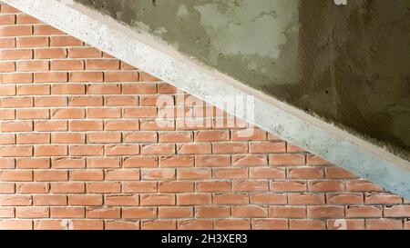 Red brick building with a modern staircase in a loft style with metal railing. Stairs adorn the building. Modern stairwell. Stee Stock Photo