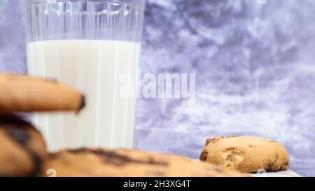 American gluten free chocolate chip cookies with glass glass of vegetable milk on gray background. Chocolate chip cookies. Sweet Stock Photo