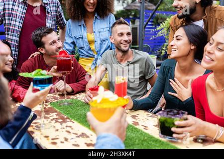Group of friends enjoying trendy afternoon drinks at happy hours terrace bar Stock Photo
