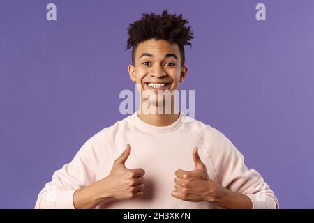 Close-up portrait of enthusiastic handsome young teenage guy, college student recommend awesome courses, online education school Stock Photo