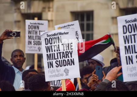 London, UK. 30th Oct, 2021. Protesters hold anti-military placards during the demonstration. Large crowds gathered outside Downing Street in protest against the military coup in Sudan and demanded a return to civilian rule. Credit: SOPA Images Limited/Alamy Live News Stock Photo