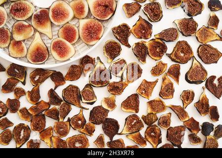 Dried figs lie next to fresh ones on the table Stock Photo