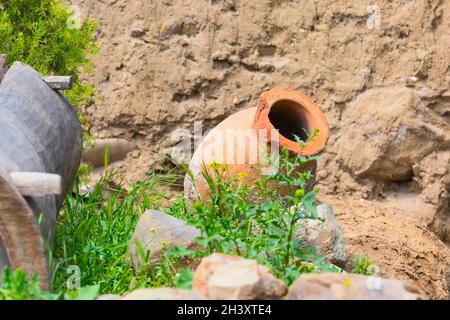 Old traditional georgian wine region symbol background with qvevri jug Stock Photo