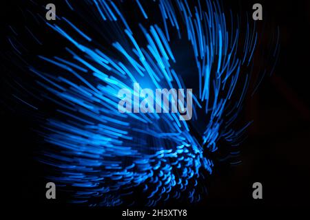 Blue abstract particles and lines with bokeh and blur in dark background Stock Photo
