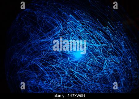 Blue abstract particles and lines with bokeh and blur in dark background Stock Photo