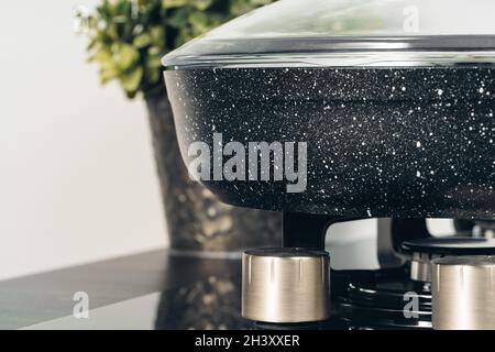 Frying pan on the gas stove in a kitchen Stock Photo