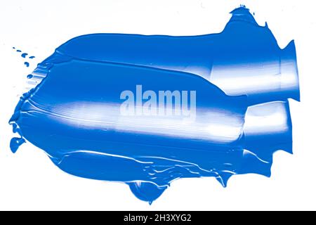 Cobalt blue beauty cosmetic texture isolated on white background, smudged makeup smear or cosmetics product smudge, paint brush Stock Photo