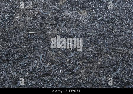 Pile of metal shavings background, industrial iron waste and steel recycle industry.