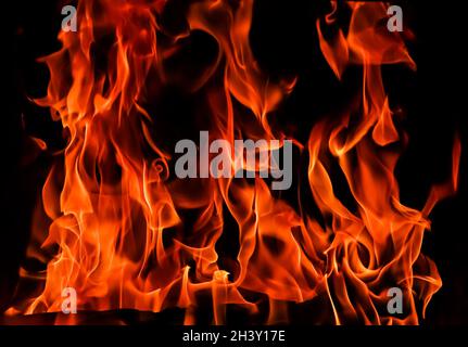 Flames of fire on a black background. The mystery of fire. Stock Photo
