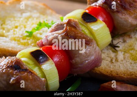 Mutton slices on barbecue skewers Stock Photo
