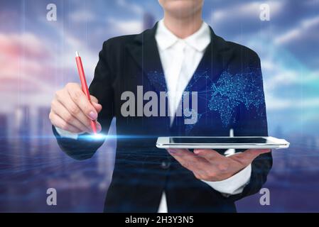 Lady In Uniform Standing Holding Tablet And Virtually Typing With Pen. Business Woman Carrying Pad Typing And Displaying New Fut Stock Photo