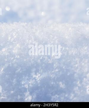 Background of fresh snow. Natural winter background. Snow texture in blue tone Stock Photo