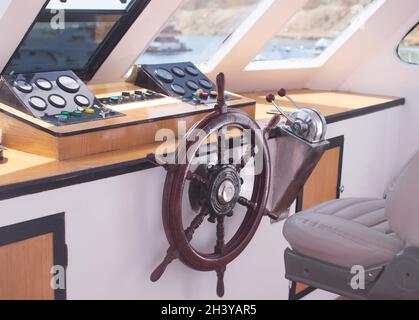 The captain's cabin. steering wheel, instruments, chair Stock Photo