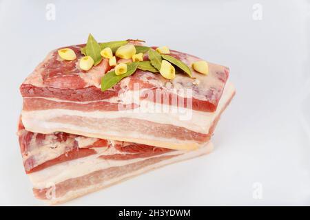 Pieces of raw pork belly isolated on white Stock Photo - Alamy