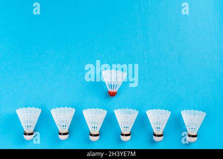 Arrangement of shuttlecocks on a blue background Stock Photo
