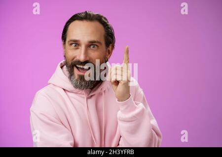 Have great idea listen. Excited energized happy charismatic male bearded guy raising index fingers add suggestion show eureka ge Stock Photo