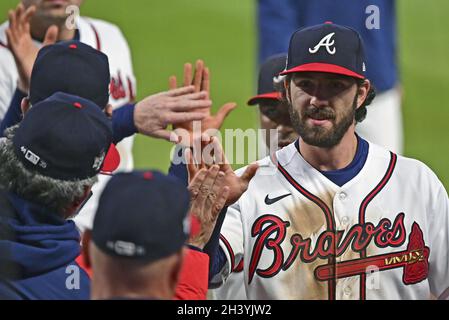 Dansby Swanson #7 of the Atlanta Braves looks on from third base during a  pitching change in the sixth inning during MLB g…