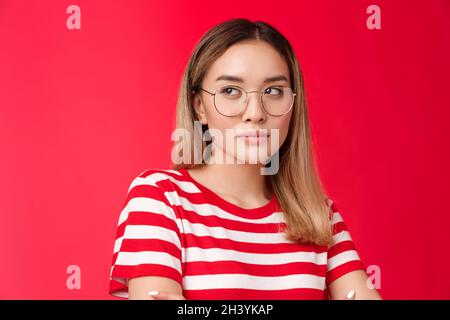 Close-up arrogant confident good-looking blond asian woman look away serious self-assured wear glasses, female journalist gather Stock Photo