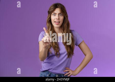 Displeased offended serious-looking assertive woman forbid express dislike and disapproval frowning annoyed shaking index finger Stock Photo