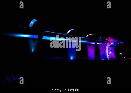 A cloroed high bridge with colored bridge supports with futuristic ...