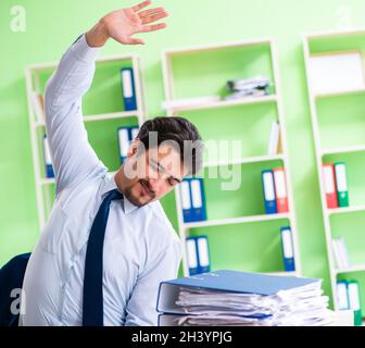 Employee doing exercises during break at work Stock Photo