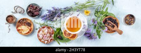 Organic tea panorama with herbs, flowers and fruit, shot from the top Stock Photo