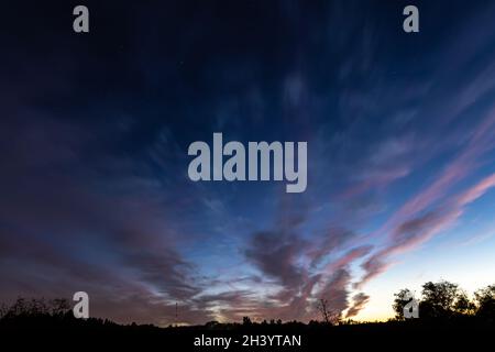Bright contrasting blue sky with color gradient. Stock Photo