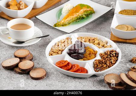 Eastern dessert tea set with nuts and dried fruits Stock Photo