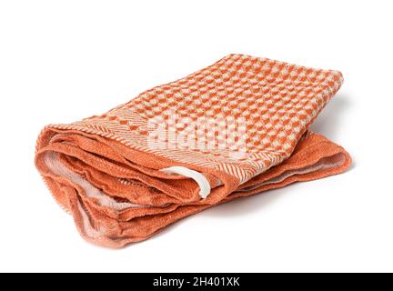 Folded orange linen towel on white background Stock Photo