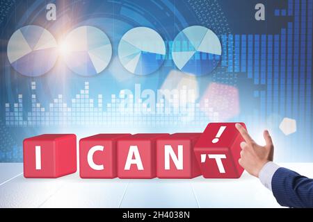 Determination concept with rotating cubes and businessman Stock Photo