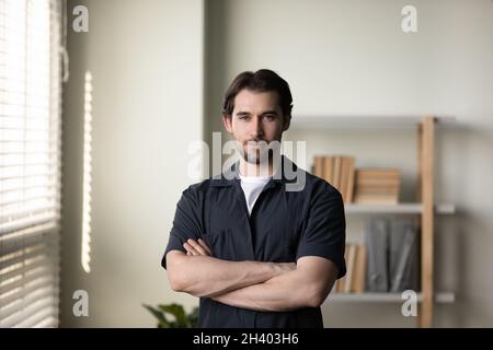 Portrait of happy young handsome man posing indoors. Stock Photo