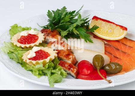 Image of dish with fish snack on white background Stock Photo