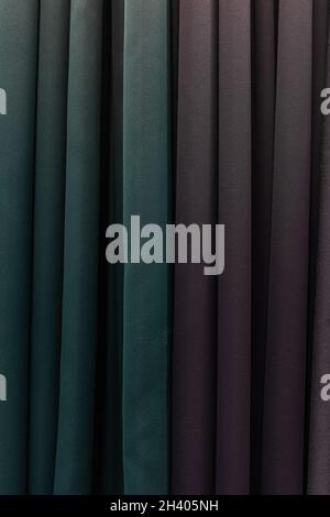 Set of dark multi-colored dense fabrics of uniform texture. Stock Photo