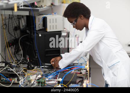 Scientist african american woman working in laboratory with electronic instruments Stock Photo