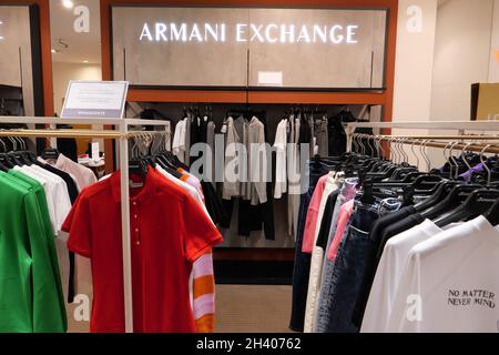 ARMANI EXCHANGE CLOTHING ON DISPLAY INSIDE THE FASHION STORE Stock